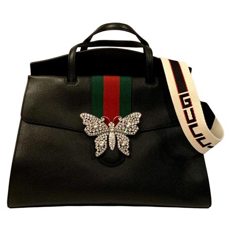 gucci purse with butterfly|Gucci bag with butterfly buckle.